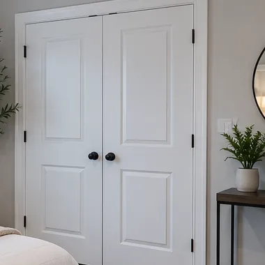 A clean apartment hallway with white double doors